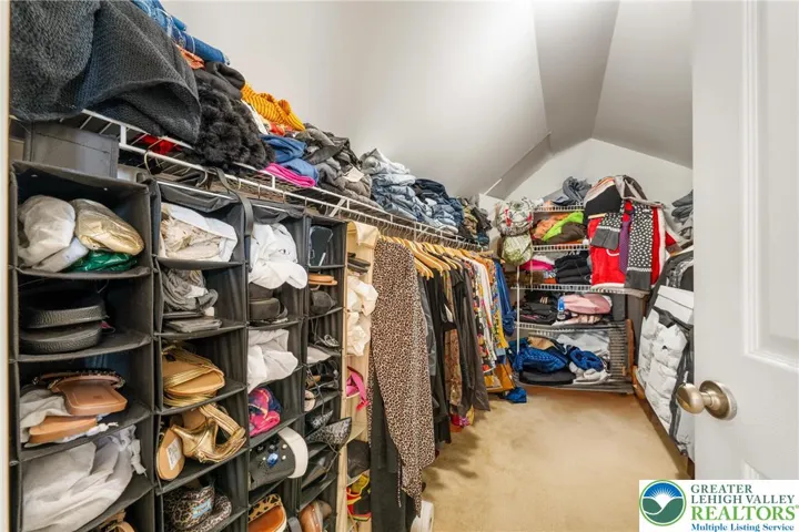 Primary bedroom walk-in closet