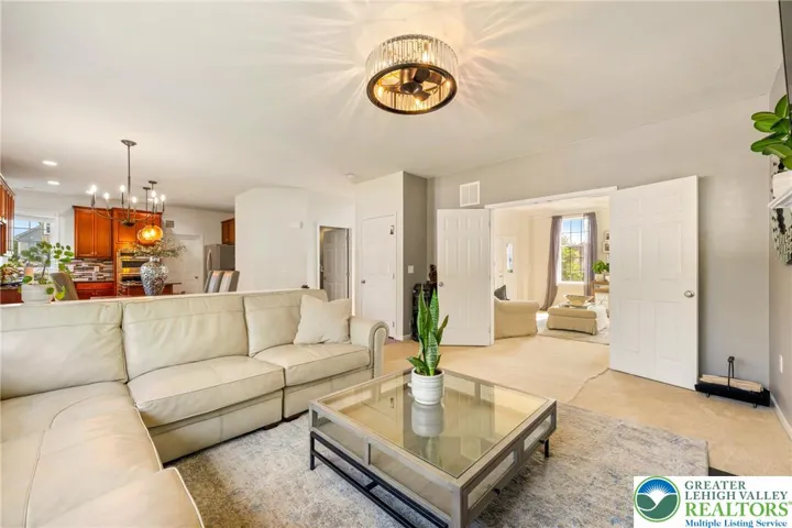 Family room with double doors leading to living room