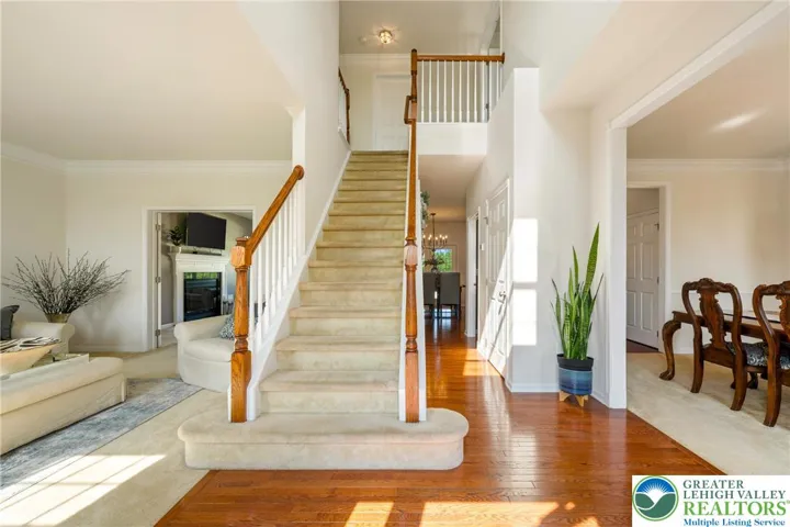 This spacious sunny foyer welcomes you home