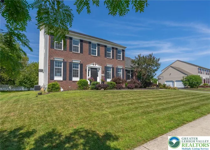 Well manicured yard with mature landscaping