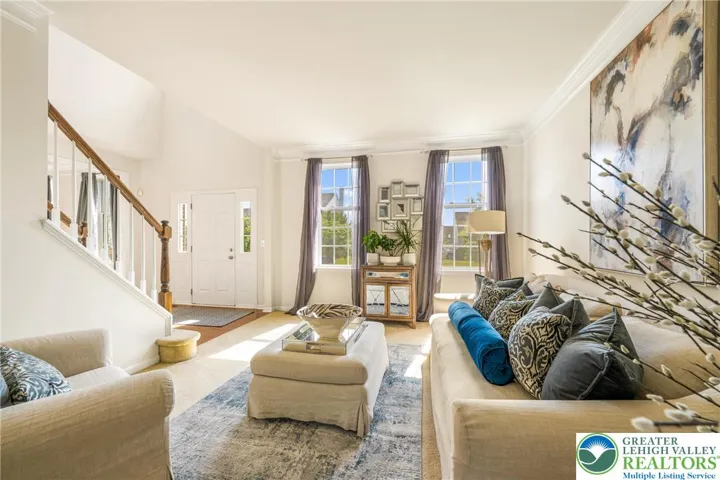 Bright living room with crown molding