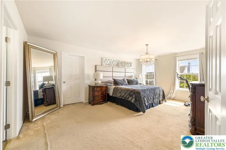 Spacious primary bedroom with walk-in closet