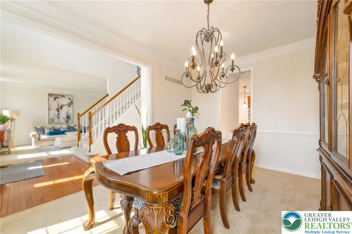 Dining room connecting to foyer and kitchen
