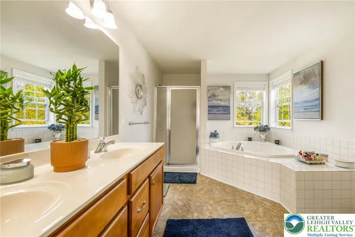 Primary bathroom with separate tub and shower