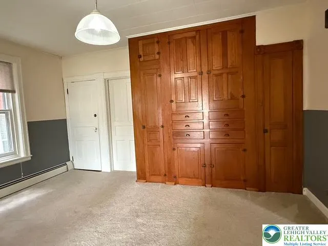 dining room with access to basement and laundry
