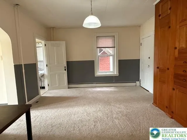 Dining room access to kitchen, bathroom and living room