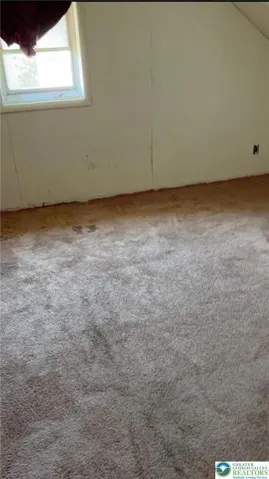 bedroom loft above a salon room of home