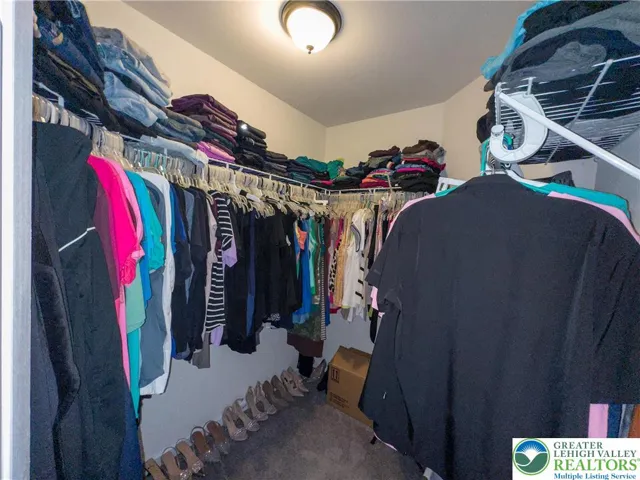 Primary bedroom walk-in closet