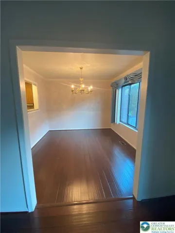 Dining room accessible from kitchen and living room.