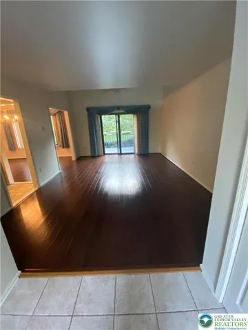 Large living room with hardwood floors leading out to the deck!