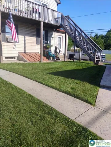 Staircase to 2nd Fl deck and apartment entrance.