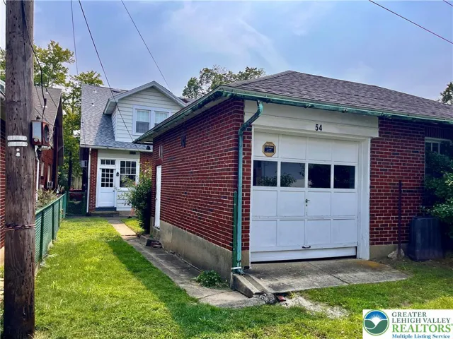 Detached garage, rear of home.