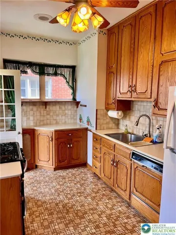 Bright kitchen and door to back yard.