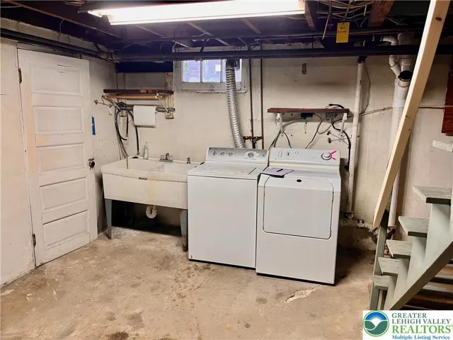 Washer & dryer stay. Convenient double utility sink.