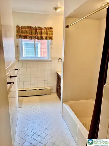 Full bath, tile floor.