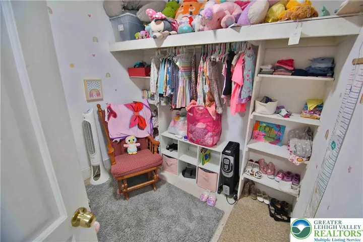 Walk-in closet at top of the stairs - could also be small home office