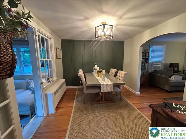 Formal dining Rm with new H/W floor & accent wall
