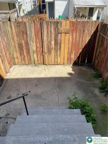 FENCED IN CONCRETE PATIO