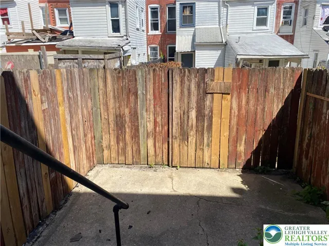 FENCED IN CONCRETE PATIO