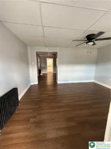 Large living room with natural lighting.
