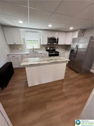 View from the dining room into the kitchen.