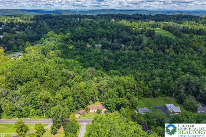 Wooded acreage behind Glen Road Residence