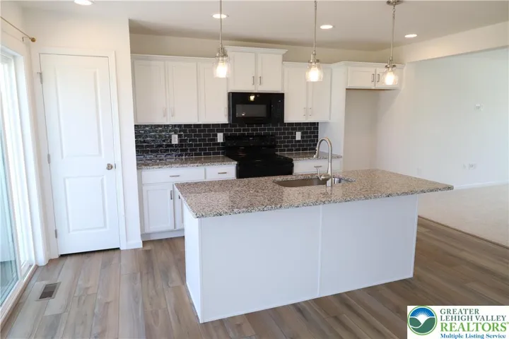 Kitchen - center island with overhang ideal for stools, refrig is on order