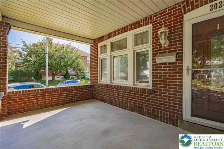 Enjoy your coffee in this relaxing covered front porch