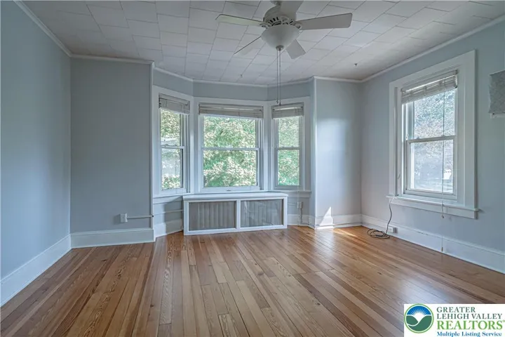 1st BR facing the street with original hardwood floor