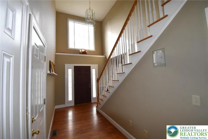 Grand Foyer with Large Window & Decorator Shelf