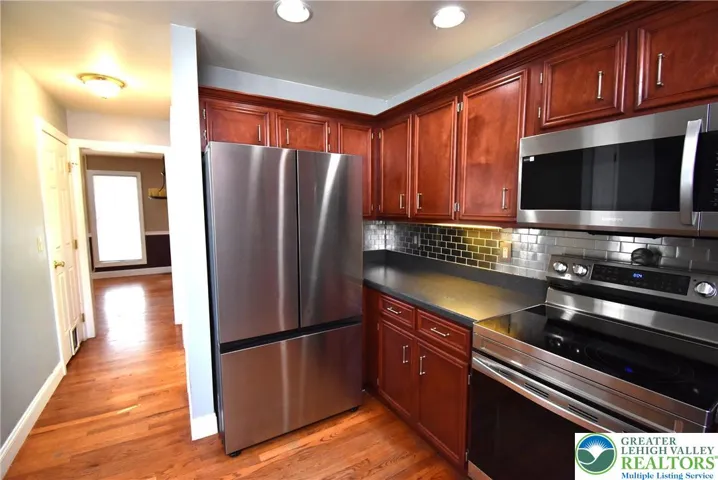 Kitchen with Cherry Cabinets and Stainless Appliances