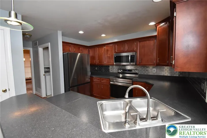 Kitchen with Cherry Cabinets and Stainless Appliances