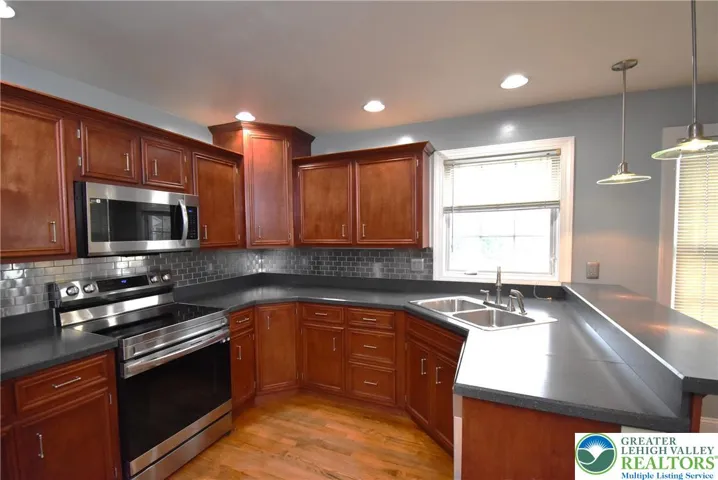 Kitchen with Cherry Cabinets and Stainless Appliances