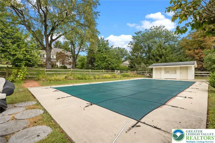 Tranquil backyard with salt water pool.