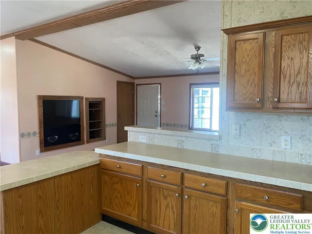 Watch TV while prepping in the kitchen