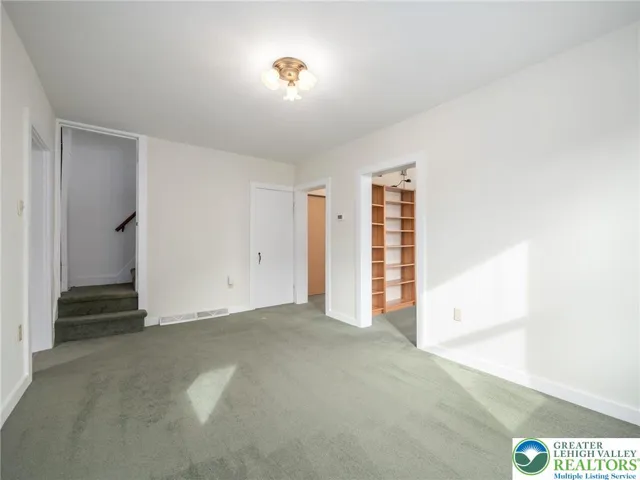 Dining Room w/ 1st flight of steps leading from floor 1 to floor 2