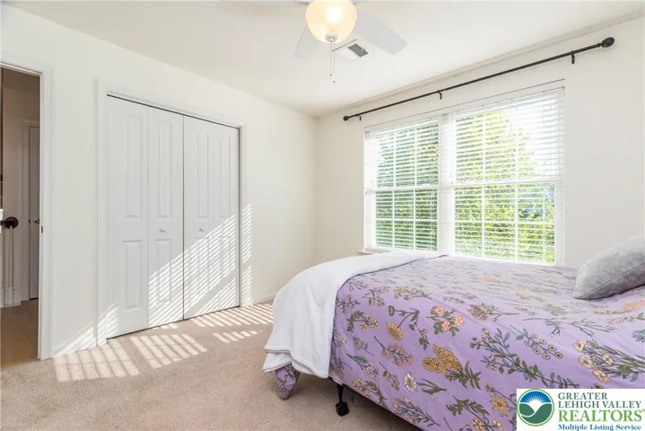 Bedroom 2 with ceiling fan/light combo