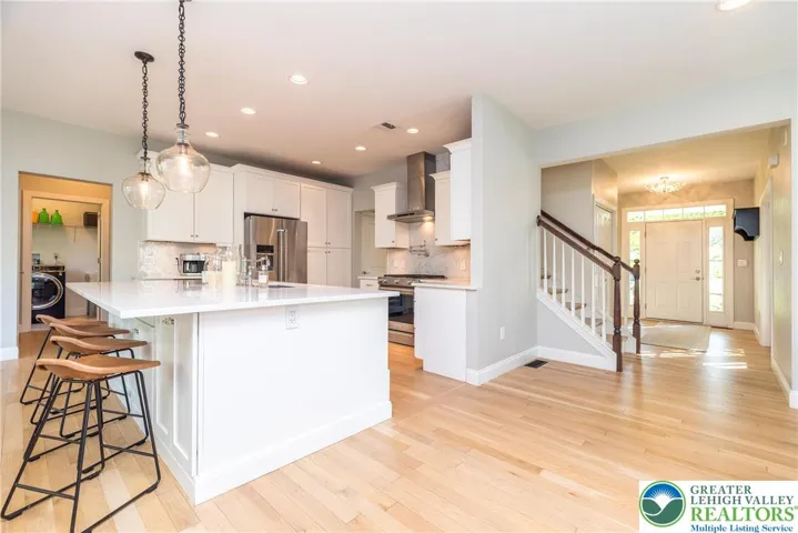 Another view of the kitchen and catch a glimpse of the laundry room