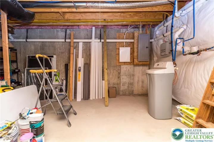 A view of the back part of the lower level. Water softener remains