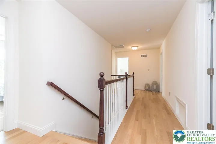 Stairs to second floor hallway and 5 bedrooms