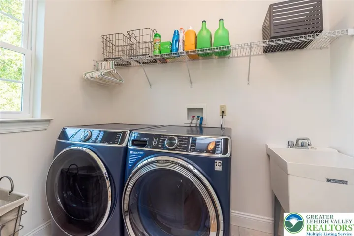 Laundry room with utility sink. Washer and dryer do not stay.