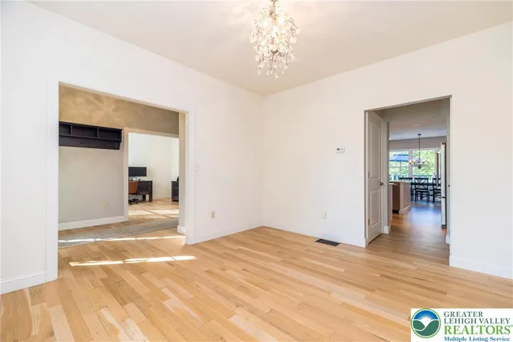 Another view of the dining room with easy access to the kitchen. Door on the left leads to lower level