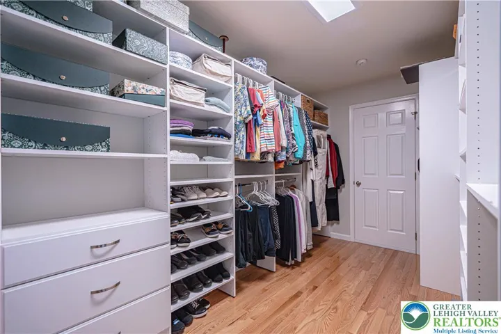 Primary walk-in closet w/door to attic