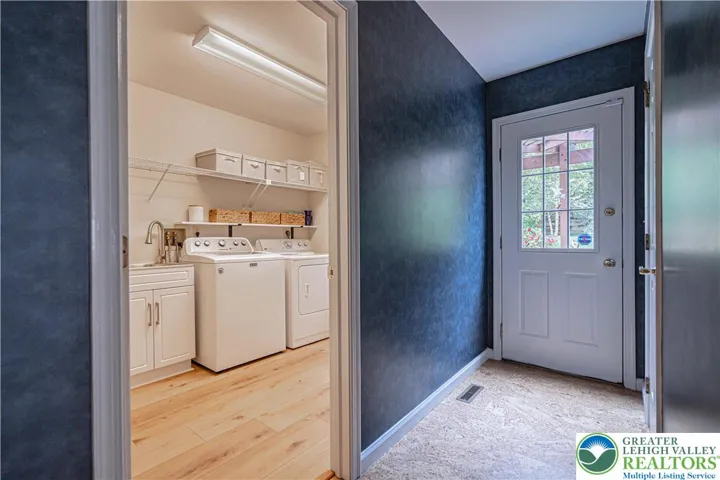 Hall w/access to laundry, garage, backyard, powder room
