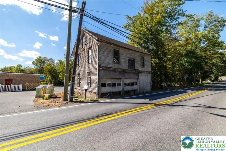 Mortise and tenon barn with two garage bays on Ridge Rd