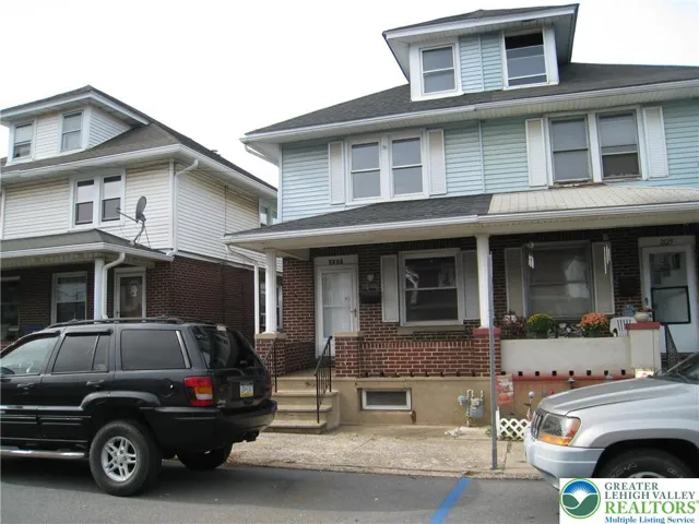 Ample front porch to relax and visit with the neighbors