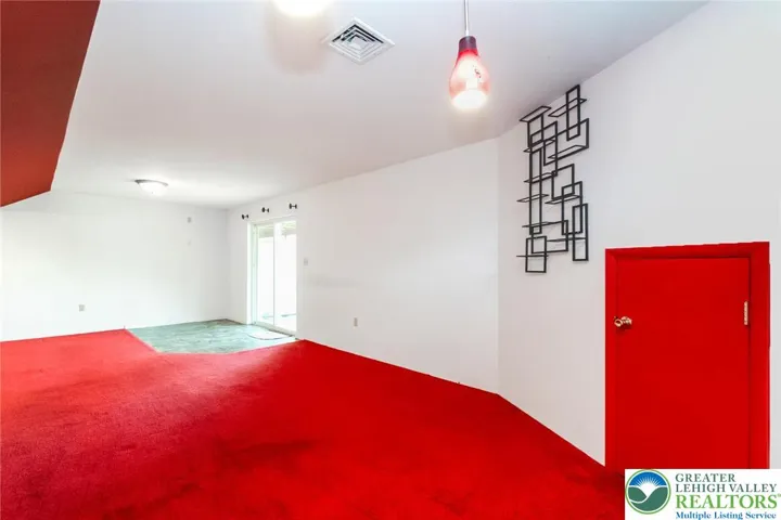 L-shaped walk-out basement family room