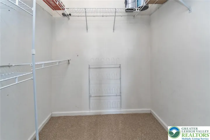 Walk-in primary bedroom closet