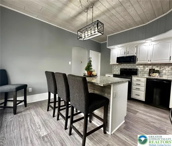 An recently added island & granite countertops throughout