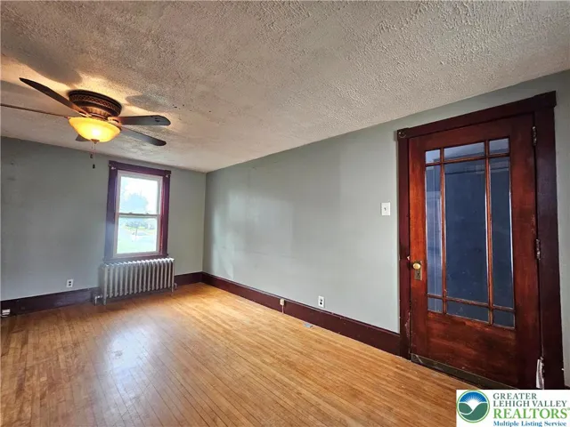 Living room toward front enclosed porch